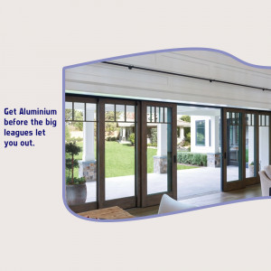 Aluminium sliding glass doors opening to a lush green garden