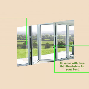 Modern aluminum bi-fold doors overlooking a green landscape