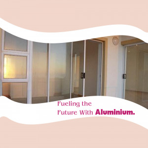Interior view of a room with white aluminum sliding doors