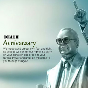 Statue of a man with glasses and a quote about struggle and rights.