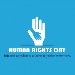 White hand cradling a smaller hand with the text 'Human Rights Day'