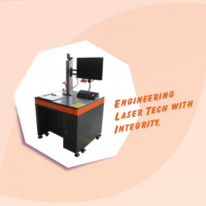 Industrial laser engraving machine with text 'Engineering Laser Tech with Integrity'