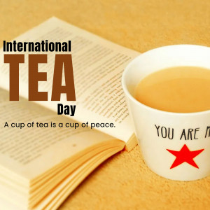A cup of tea and an open book with text 'International Tea Day'
