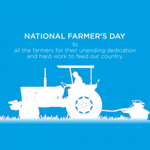 Silhouette of a tractor and farmer against a blue background with text celebrating National Farmer's Day.