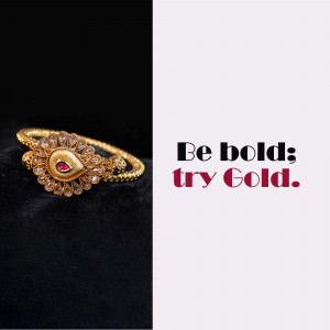 Close-up of a gold bracelet with ruby stones, advertising gold jewelry.