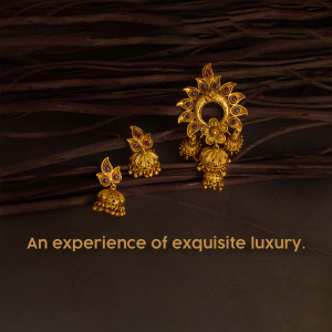 Close-up of a traditional Indian gold jewelry set including earrings and a headpiece