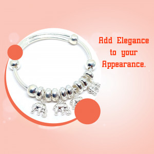 Close-up of a silver bracelet with elephant charms, perfect for adding elegance to any outfit.