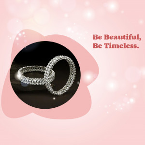 Close-up of two silver bangles with sparkling stones, set against a pink and black background with text 'Be Beautiful, Be Timeless'.