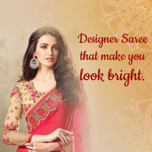 Woman wearing a red and gold designer saree