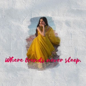 Woman in a yellow dress posing on a textured surface with text overlay