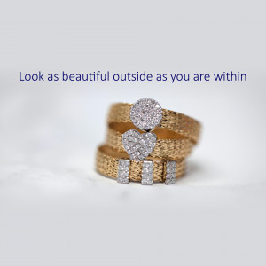 Close-up of gold rings with diamond accents