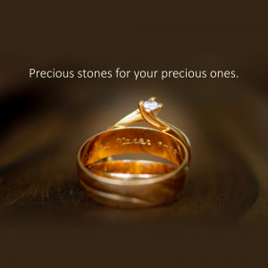 Close-up of two gold wedding rings with a diamond