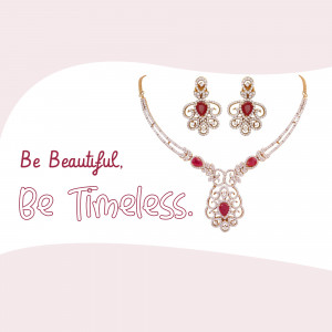 Close-up of a ruby and diamond necklace and earrings set against a pink background.