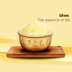 A bowl of ghee on a wooden surface with a yellow background.