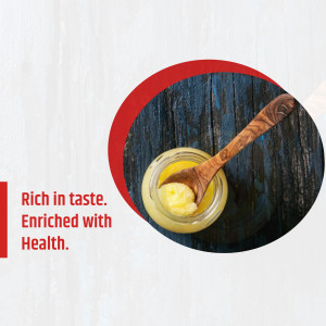 Close-up of ghee in a glass jar with a wooden spoon