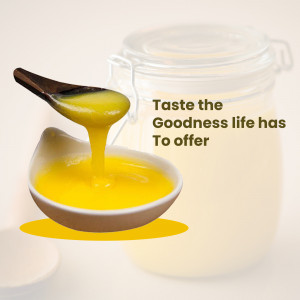 A jar of ghee with a spoonful being poured into a small bowl.