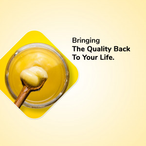 Close-up of honey in a glass jar with a wooden spoon