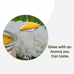 Close-up of a spoonful of ghee over a bed of white rice with a bowl of curry in the background.