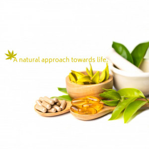 Close-up of herbal supplements, capsules, and leaves with text 'A natural approach towards life.'