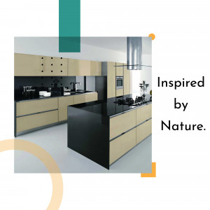 A modern kitchen with a beige and black color scheme and stainless steel appliances.