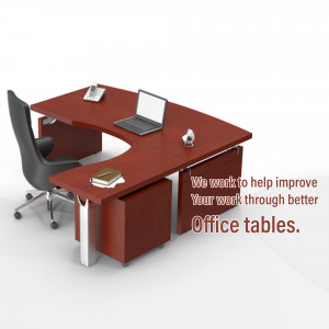 A modern executive office desk with a laptop, chair, and office supplies.