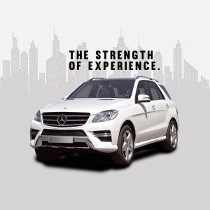 White Mercedes-Benz GLE parked in front of a city skyline