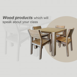 A modern wooden dining table with four chairs.