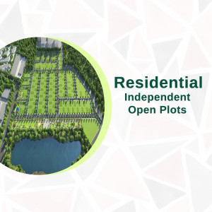 Aerial view of residential plots with a lake and green spaces