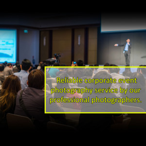Speaker presenting to a large audience at a corporate event