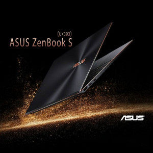 ASUS ZenBook S UX393 laptop floating in the air with golden particles