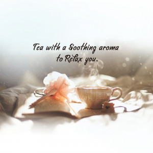 A cup of tea with a flower and an open book, evoking a sense of calm and relaxation.