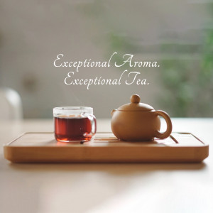 A cup of tea and a teapot on a wooden tray