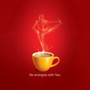 A yellow cup of tea with steam forming the shape of a person running.