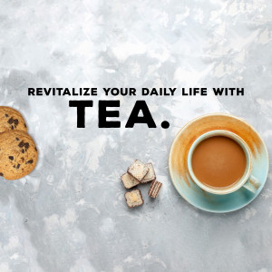 Cup of tea with cookies and sugar cubes on a marble surface