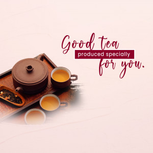 Teapot and teacups with loose tea leaves on a wooden tray