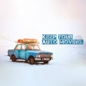 Vintage blue car with luggage on the roof in a snowy landscape with text 'Keep Your Auto Moving'.