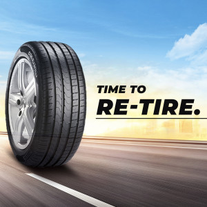 Close-up of a car tire with the text 'Time to Re-tire'