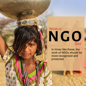 Young girl carrying water with World NGO Day message