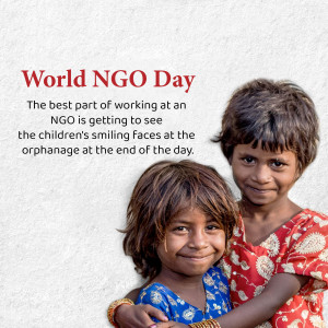 Two smiling children at an orphanage celebrating World NGO Day.