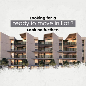 Exterior view of a modern apartment building with balconies and greenery.