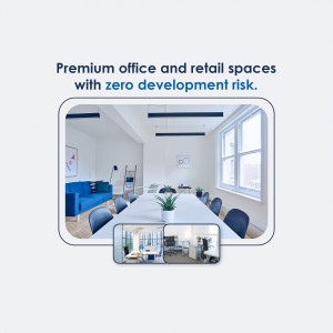 Modern office space with a long conference table and comfortable seating.