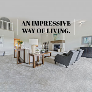 A bright and spacious living room with modern furniture and a fireplace.