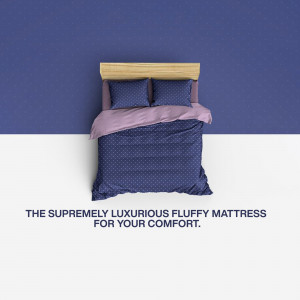 A bed with a blue and pink patterned duvet and pillows on a bed frame, set against a two-tone blue and white background.