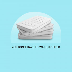 Stack of white mattresses with text 'You don't have to wake up tired'