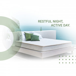 A comfortable bed with green pillows and a bottle of water, promoting restful sleep.
