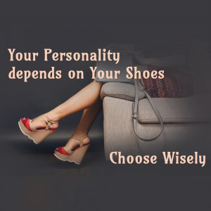 Woman's legs with red wedge sandals and a handbag on a couch