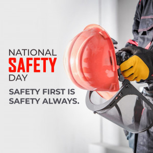 Worker holding a safety helmet with National Safety Day text