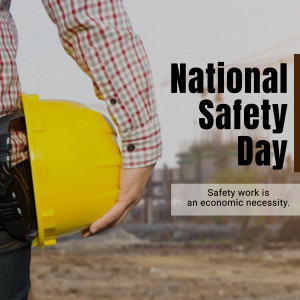 Worker holding a yellow hard hat with National Safety Day text