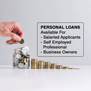 Hand dropping a coin into a jar with other coins, with a sign advertising personal loans.