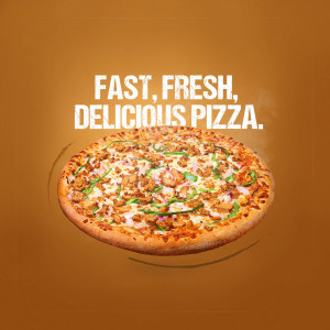 A close-up of a delicious pizza with various toppings on a brown background.